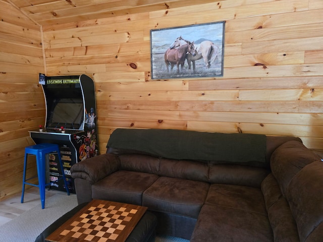 1093 N Chester Rd, Chester, ME 04457 - carpeted living area featuring wood walls and vaulted ceiling