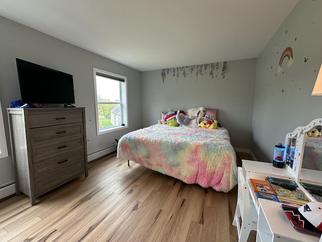 64 Litchfield Rd, Bowdoin, ME 04287 - bedroom featuring light wood finished floors and a baseboard heating unit