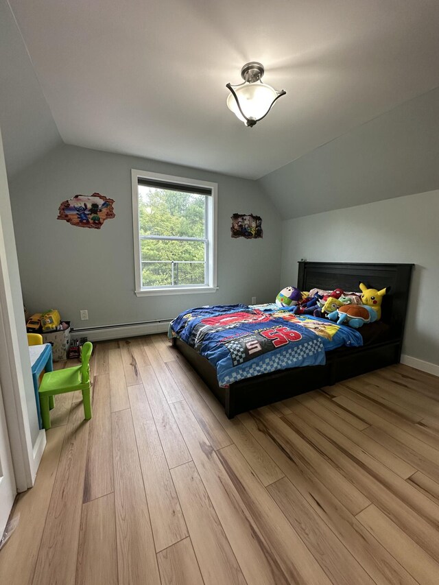 64 Litchfield Rd, Bowdoin, ME 04287 - bedroom featuring lofted ceiling, light wood-style flooring, and a baseboard radiator