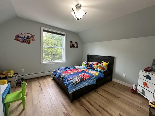 64 Litchfield Rd, Bowdoin, ME 04287 - bedroom featuring a baseboard heating unit, lofted ceiling, and wood finished floors