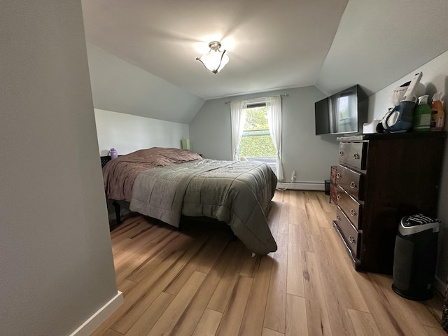 64 Litchfield Rd, Bowdoin, ME 04287 - bedroom featuring lofted ceiling, light wood-style floors, and baseboard heating