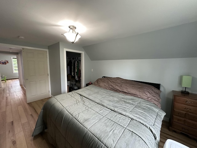64 Litchfield Rd, Bowdoin, ME 04287 - bedroom with light wood-style floors and lofted ceiling