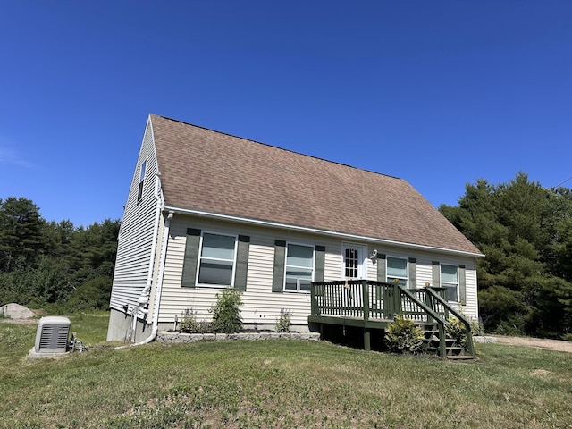 64 Litchfield Rd, Bowdoin, ME 04287 - view of front of property with a deck, a front yard, and roof with shingles