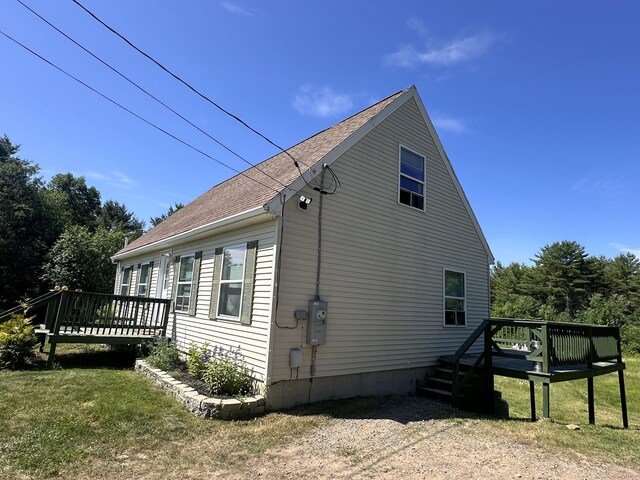 64 Litchfield Rd, Bowdoin, ME 04287 - view of home's exterior featuring a wooden deck and a shingled roof