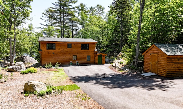 51 Short Point Way, Orland, ME 04472 - view of side of property featuring a storage shed and driveway