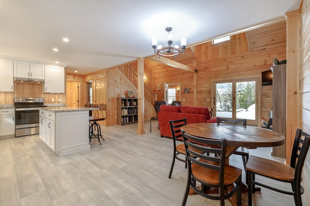 51 Short Point Way, Orland, ME 04472 - dining space featuring wooden walls, stairway, a chandelier, and recessed lighting