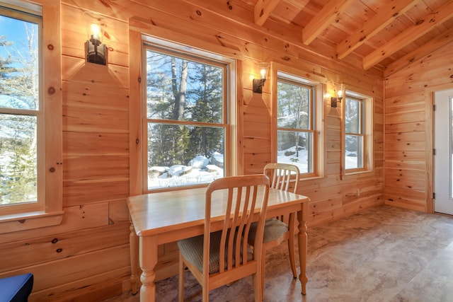 51 Short Point Way, Orland, ME 04472 - dining space featuring wood walls, wood ceiling, and carpet flooring