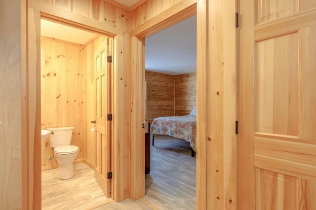 51 Short Point Way, Orland, ME 04472 - corridor with light wood-style floors and wood walls