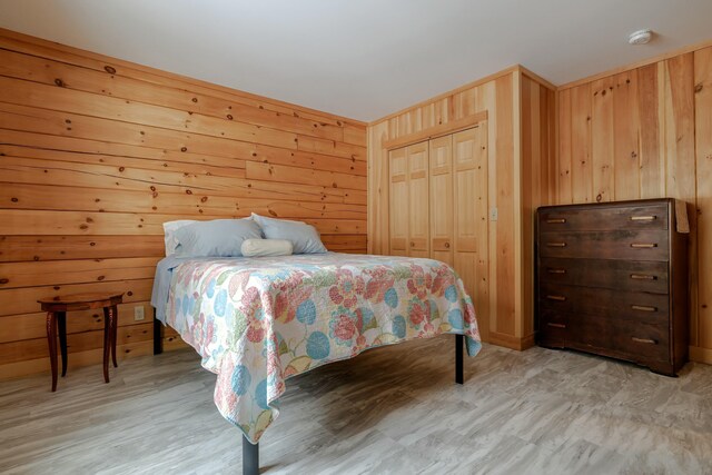 51 Short Point Way, Orland, ME 04472 - bedroom featuring wooden walls and a closet