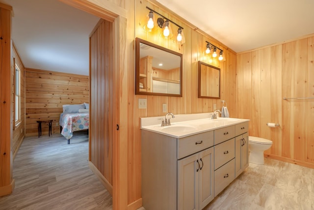 51 Short Point Way, Orland, ME 04472 - full bathroom featuring wood walls, double vanity, and ensuite bathroom