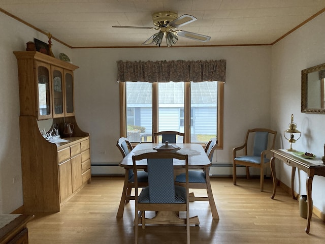 1 Francis Rd, Steuben, ME 04680 - dining space with crown molding, light wood-style flooring, ceiling fan, and a baseboard heating unit