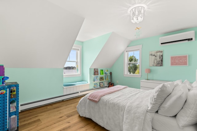 352 River Rd, Eliot, ME 03903 - bedroom with a wall mounted air conditioner, multiple windows, a baseboard radiator, wood finished floors, and lofted ceiling
