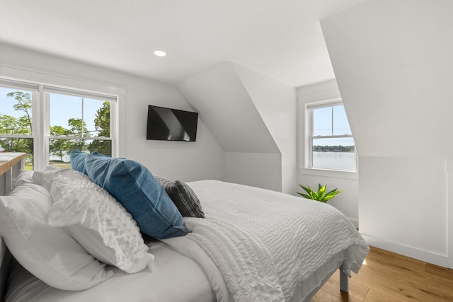 352 River Rd, Eliot, ME 03903 - bedroom featuring multiple windows, light wood-type flooring, vaulted ceiling, and recessed lighting