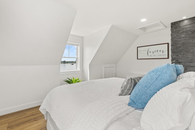 352 River Rd, Eliot, ME 03903 - bedroom with attic access, wood finished floors, lofted ceiling, and recessed lighting