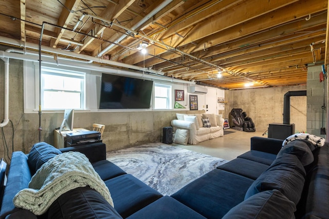352 River Rd, Eliot, ME 03903 - living area featuring concrete flooring and an AC wall unit