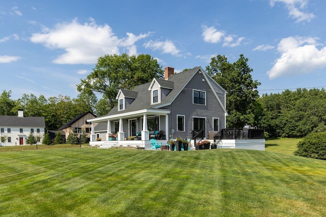 352 River Rd, Eliot, ME 03903 - rear view of property featuring a lawn, covered porch, and a chimney