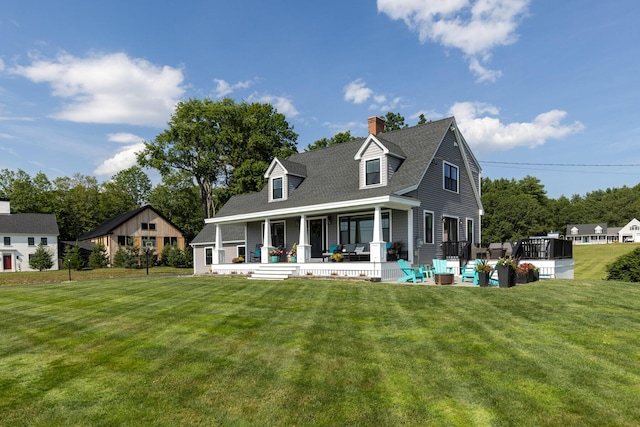 352 River Rd, Eliot, ME 03903 - rear view of house with covered porch, a lawn, a chimney, and a shingled roof