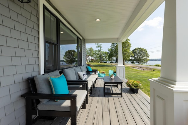352 River Rd, Eliot, ME 03903 - porch with an outdoor hangout area, a lawn, and a water view