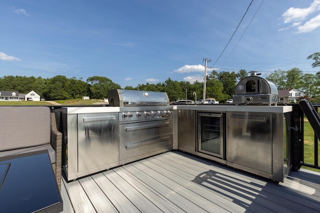 352 River Rd, Eliot, ME 03903 - wooden deck with an outdoor kitchen and wine cooler