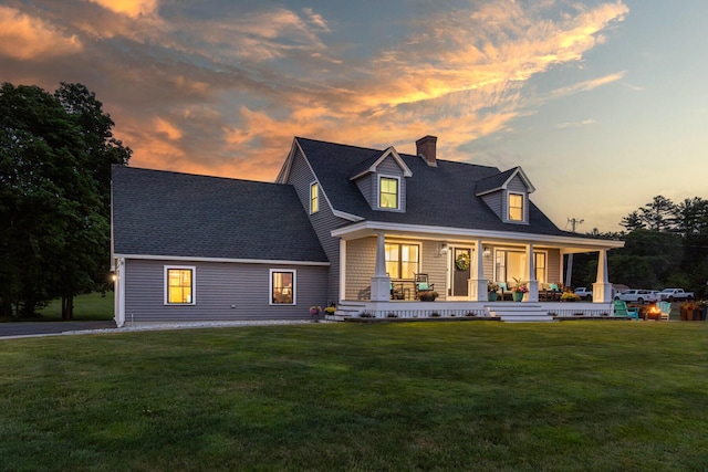 352 River Rd, Eliot, ME 03903 - view of front of property featuring a chimney, covered porch, a yard, and roof with shingles