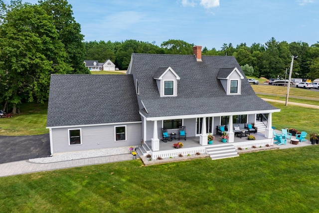 352 River Rd, Eliot, ME 03903 - rear view of house with outdoor lounge area, roof with shingles, and a lawn
