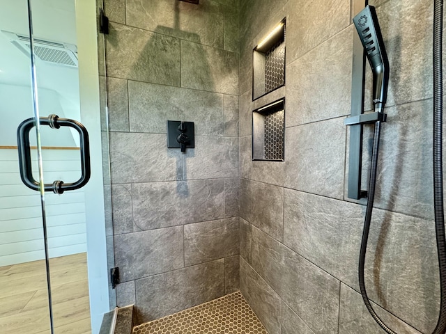 352 River Rd, Eliot, ME 03903 - full bathroom featuring a shower stall and wood finished floors