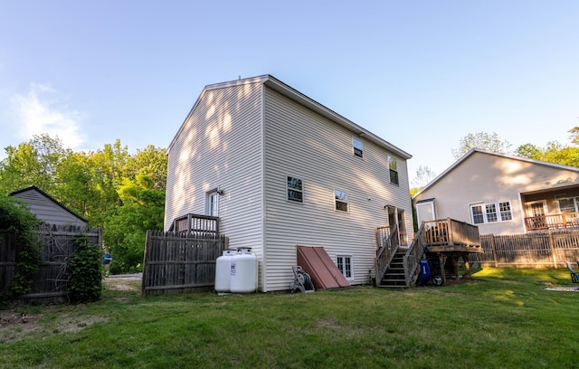 9 St James Pl, Lewiston, ME 04240 - rear view of house with a deck and stairs