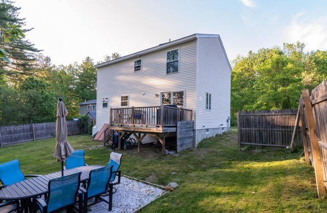 9 St James Pl, Lewiston, ME 04240 - back of house featuring a deck, a fenced backyard, and outdoor dining space