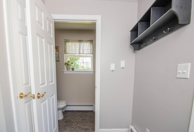 9 St James Pl, Lewiston, ME 04240 - laundry room featuring a baseboard radiator