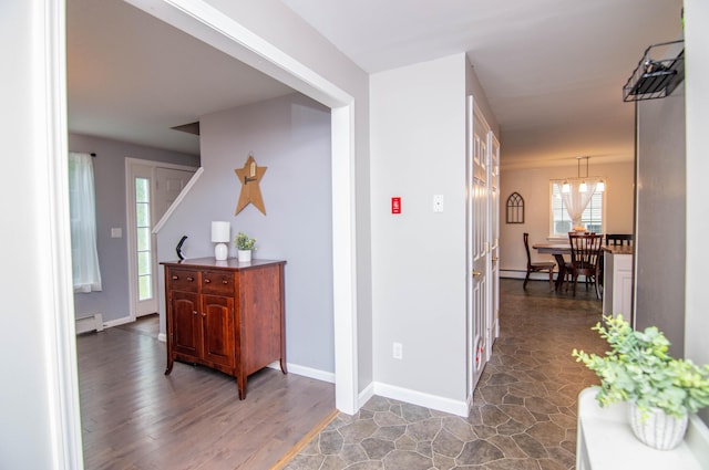 9 St James Pl, Lewiston, ME 04240 - hallway featuring baseboard heating and wood finished floors