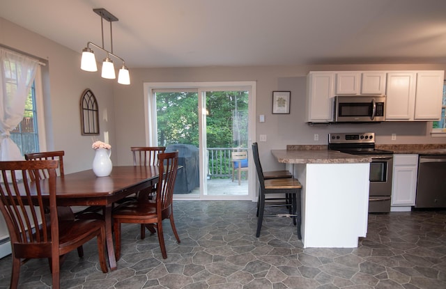 9 St James Pl, Lewiston, ME 04240 - dining area with dark stone finish flooring