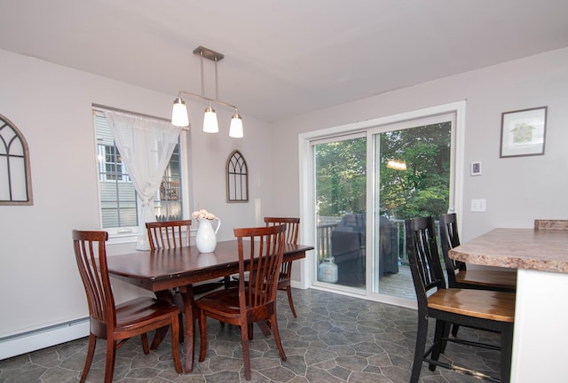 9 St James Pl, Lewiston, ME 04240 - dining area featuring baseboard heating and dark stone finish floors