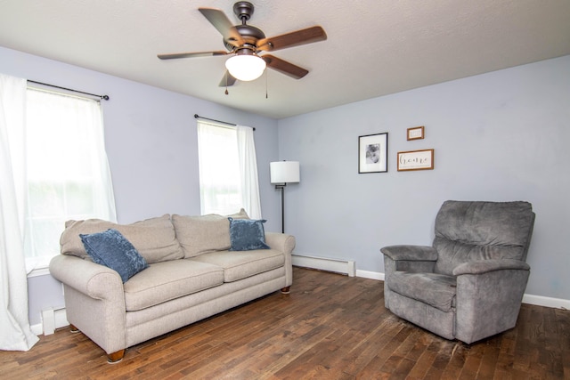 9 St James Pl, Lewiston, ME 04240 - living room featuring a baseboard radiator, a ceiling fan, and wood finished floors