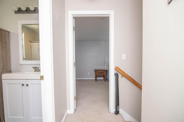 9 St James Pl, Lewiston, ME 04240 - hallway featuring light carpet and an upstairs landing