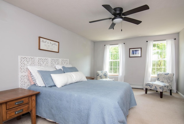9 St James Pl, Lewiston, ME 04240 - bedroom featuring a baseboard heating unit, light carpet, and ceiling fan