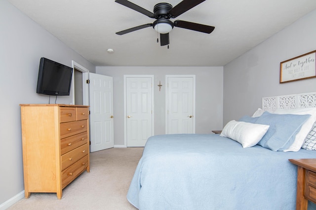 9 St James Pl, Lewiston, ME 04240 - bedroom featuring light colored carpet, ceiling fan, and two closets