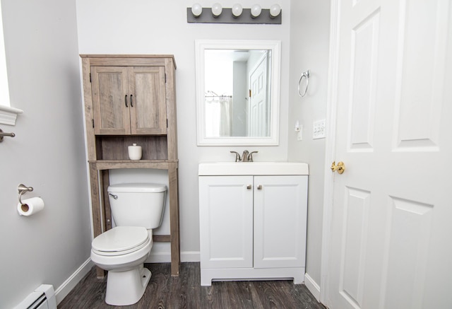 9 St James Pl, Lewiston, ME 04240 - bathroom featuring a baseboard radiator, vanity, and wood finished floors