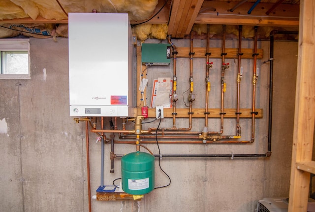 9 St James Pl, Lewiston, ME 04240 - utility room with tankless water heater