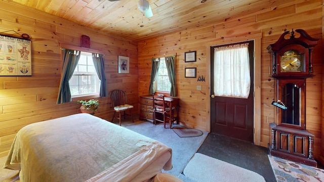 25 Loop Rd, Chester, ME 04457 - bedroom with wood walls, carpet, and wood ceiling