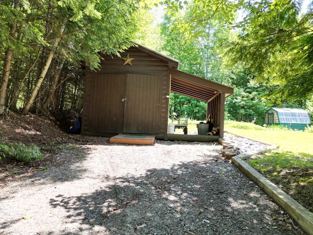 25 Loop Rd, Chester, ME 04457 - view of greenhouse featuring a storage shed