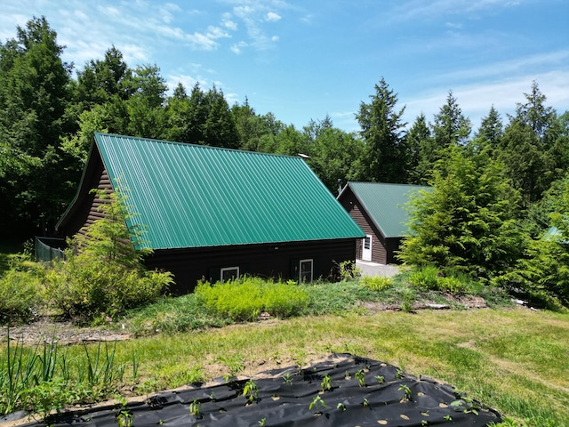 25 Loop Rd, Chester, ME 04457 - view of home's exterior featuring a metal roof
