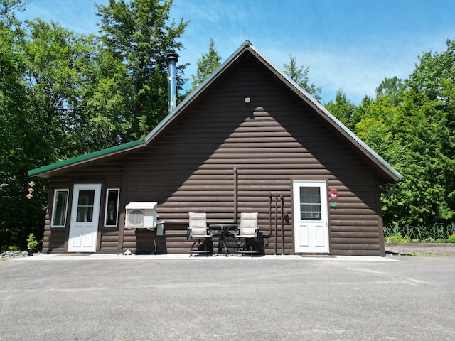 25 Loop Rd, Chester, ME 04457 - view of side of property with log veneer siding