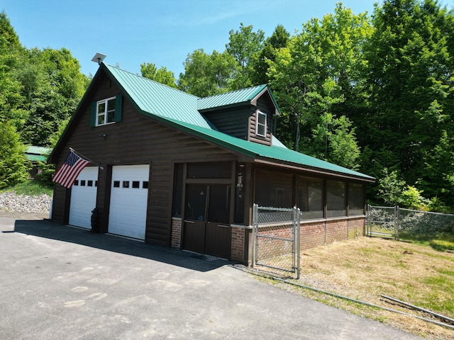 25 Loop Rd, Chester, ME 04457 - view of side of property with a gate and a metal roof