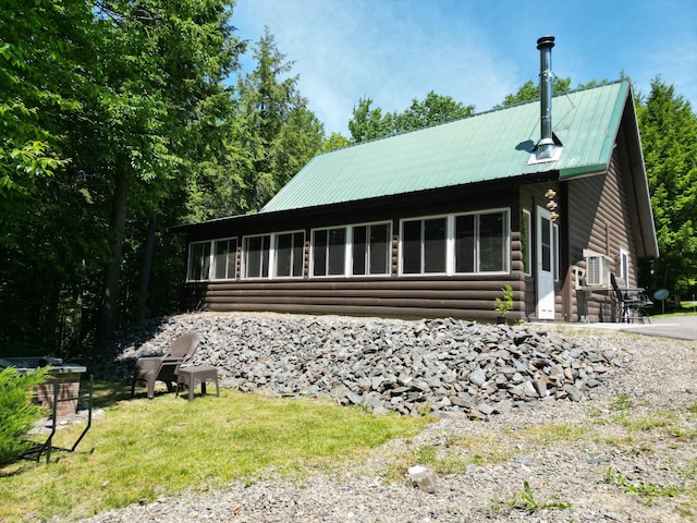 25 Loop Rd, Chester, ME 04457 - view of front of home featuring log veneer siding and a metal roof