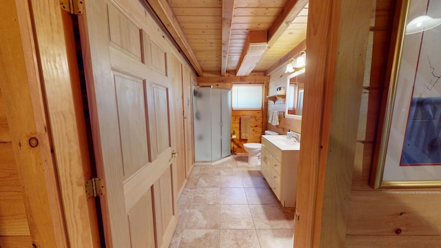 25 Loop Rd, Chester, ME 04457 - full bath featuring a wood ceiling with exposed beams, vanity, a stall shower, wood walls, and tile patterned floors