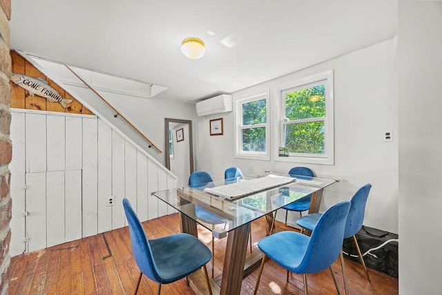 3 Surf Ave, Biddeford, ME 04005 - dining room featuring a wall mounted AC and wood-type flooring