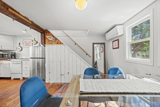 3 Surf Ave, Biddeford, ME 04005 - office with an AC wall unit, light wood finished floors, and attic access