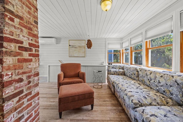 3 Surf Ave, Biddeford, ME 04005 - sunroom with wood finished floors, a wall mounted AC, and wooden ceiling