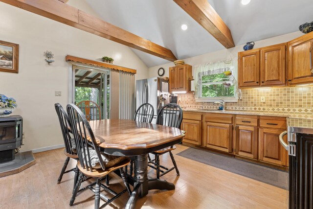 175 Buck N Doe Trl, Augusta, ME 04330 - dining room featuring light wood-style flooring, a wood stove, and recessed lighting