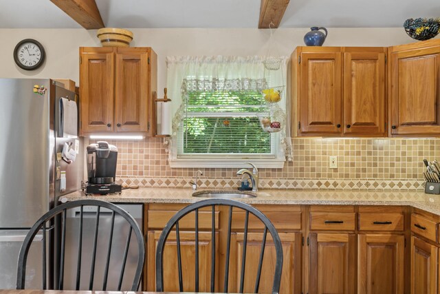 175 Buck N Doe Trl, Augusta, ME 04330 - kitchen with freestanding refrigerator, backsplash, beamed ceiling, brown cabinets, and light stone countertops